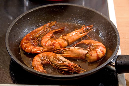 baking shrimps in pan in closeup