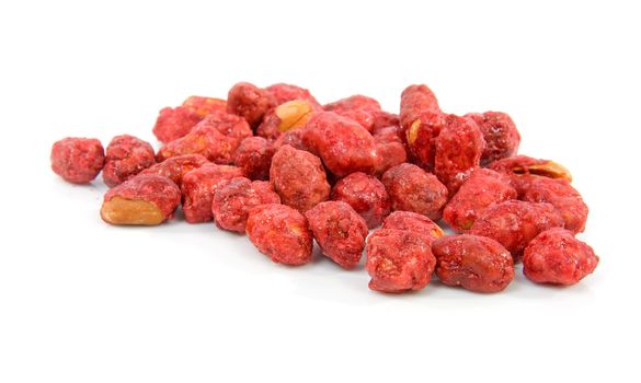 sugared peanuts in closeup isolated over white background