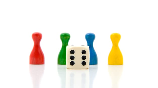 four colorful pawns with white dice over white background