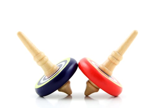 Two spinning tops isolated on white background