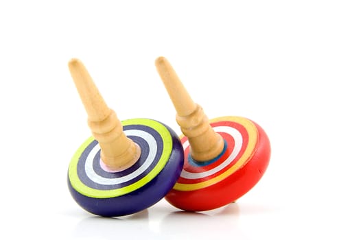 Two spinning tops isolated on white background