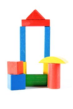 colorful woorden building blocks over white background