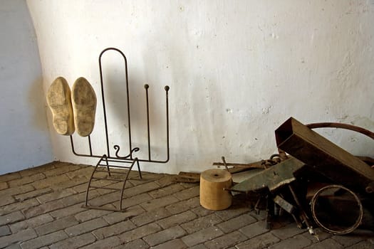 old parts and Dutch wooden shoed inside windmill