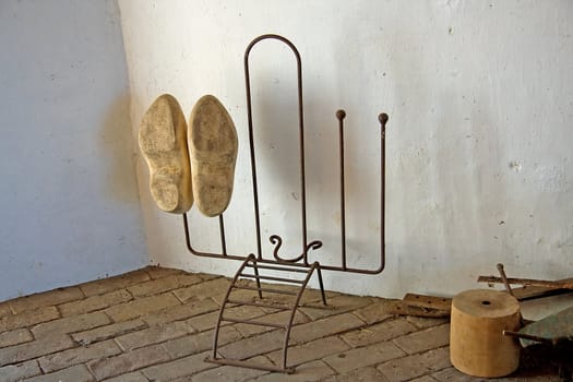 old parts and Dutch wooden shoed inside windmill