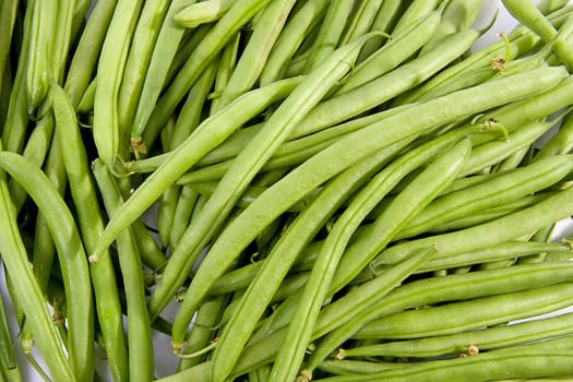 raw long green beans in closeup