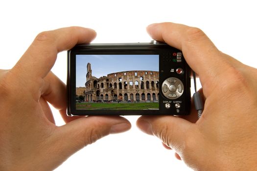 Photo camera in hands taking picture of colosseum in Rome isolated on white background