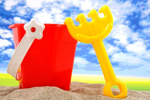 plastic play toys for at the beach over white background