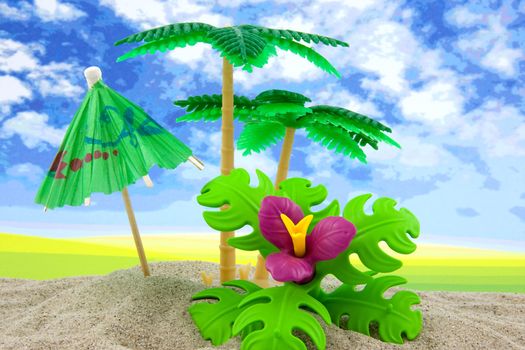 plastic toy palm tree and umbrella at the beach