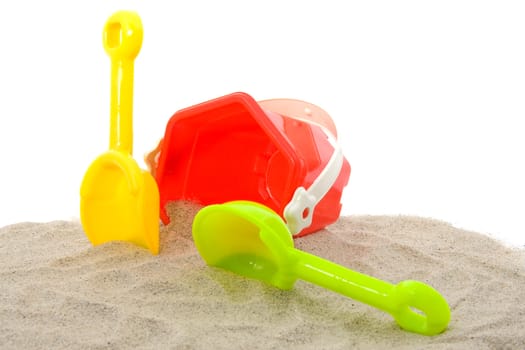 plastic play toys for at the beach over white background