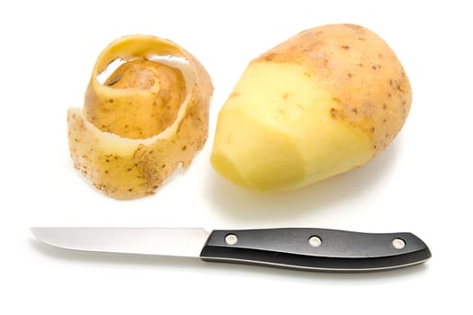 Half peeled potato with knife over white background