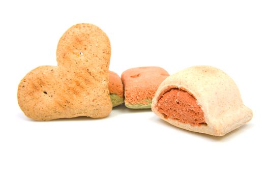 Funny shapes dog cookies over white background