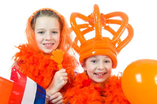 Two girls are posing in orange outfit for soccer game or queensday over white background