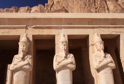 Three ancient statues in Hatshepsut's temple in Egypt