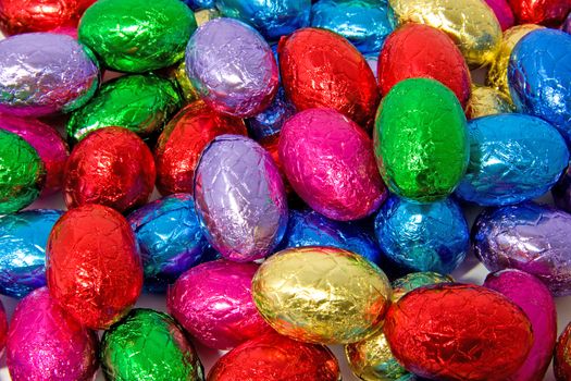 colorful chocolate easter eggs in closeup can be used as background