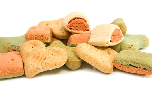 Pile of dog cookies over white background