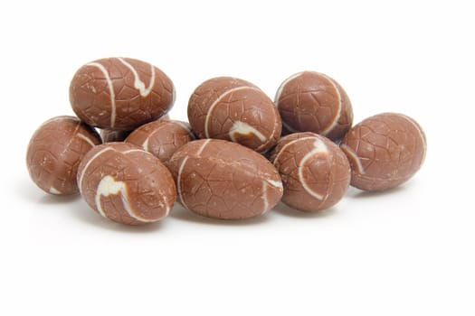 Pile of chocolate easter eggs isolated on white background