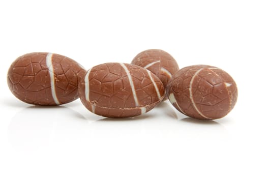 four chocolate easter eggs isolated on white background