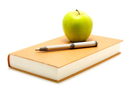 Student accessory with book, pen and apple over white background