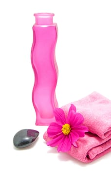 Pink bathroom accessory for spa over white background
