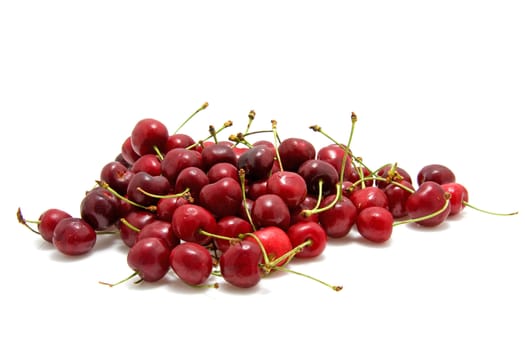Pile of fresh red cherries isolated on white background