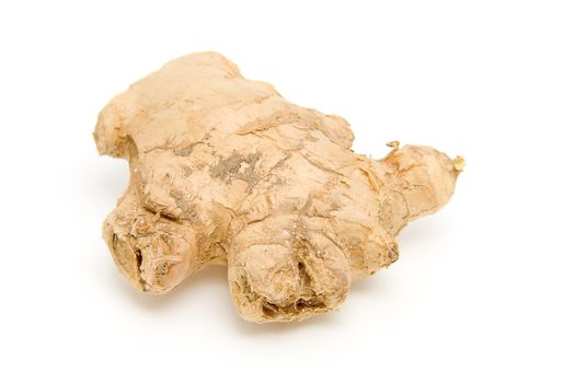 Piece of fresh ginger isolated on white background