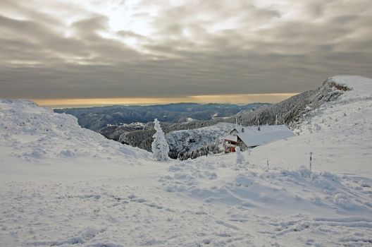 Winter landscape with shelter om Ceahlau mountain