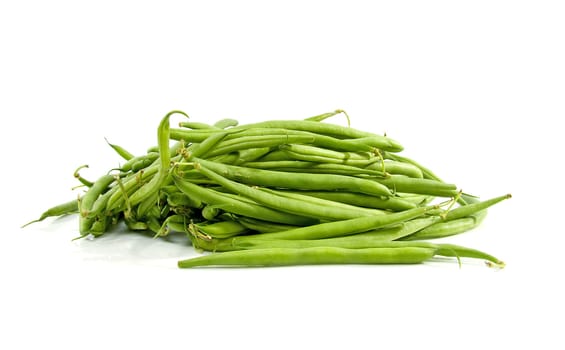 Pile of raw green long beans over white background