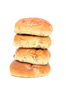 pile of raisin bread, also known as krentenbollen, isolated on white background
