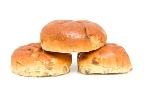 pile of raisin bread, also known as krentenbollen, isolated on white background