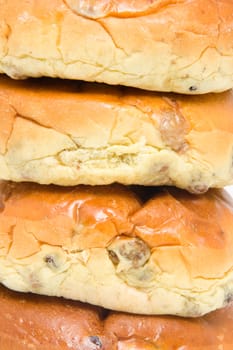 pile of raisin bread, also known as krentenbollen,in closeup