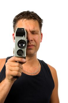 man is filming with old fashioned film camera over white background