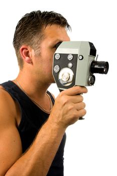 man is filming with old fashioned film camera over white background