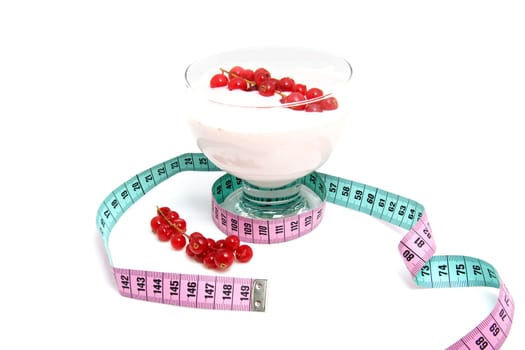 glass bowl with yogurt,berrie fruit and measure tape for dieting over white background