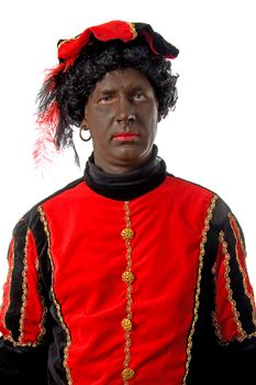 Zwarte piet ( black pete) typical Dutch character part of a traditional event celebrating the birthday of  Sinterklaas in december over white background looking into camera