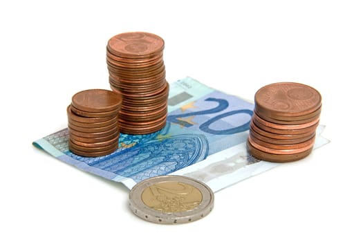 Euro money: stack of coins and paper over white background