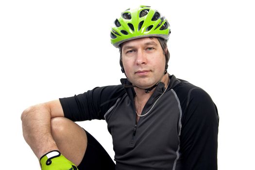 Cyclist in closeup posing over white background