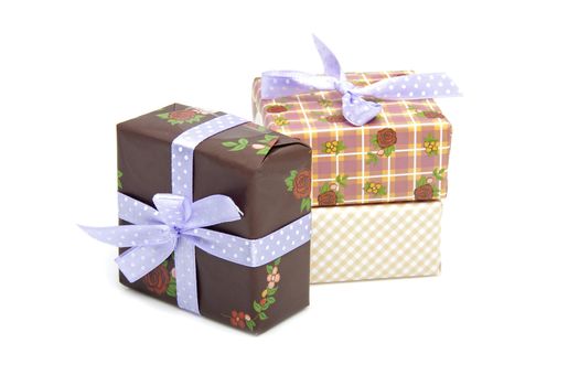 Pile of birthday presents over white background