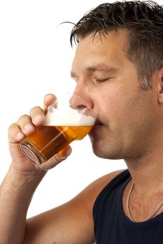 Man enjoys his cold beer in closeup over white background