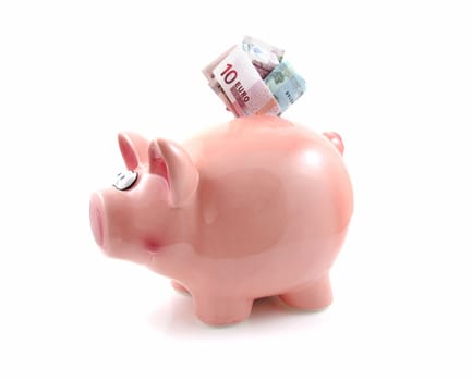 Piggy bank with money isolated on white background