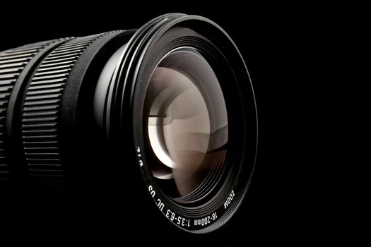 Closeup of camera lens over black background