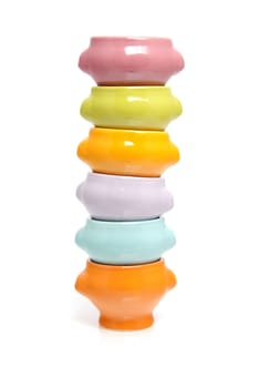 stack of colorful bowls isolated on white background