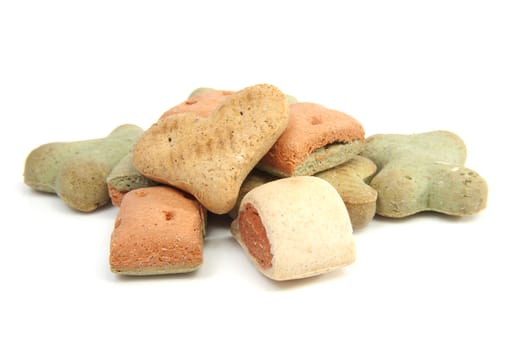 pile of funny shaped dog cookies isolated on white background