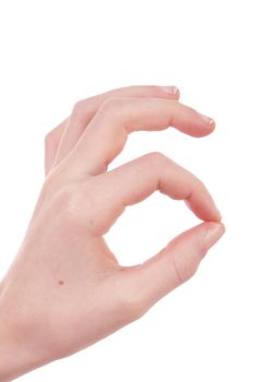 Kids hand is making OK sign over white background
