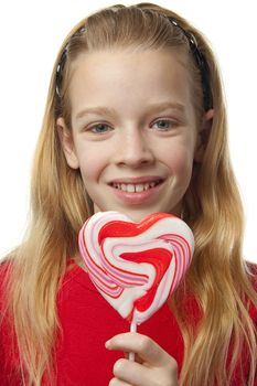 Young blonde girl with lollipops over white background