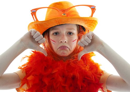 Unhappy soccer supporter: young blonde girl in orange outfit with thumbs down