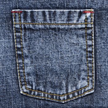 Colose up of blue jeans pocket.