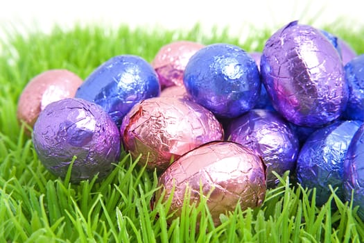 Closeup of colorful easter eggs on grass