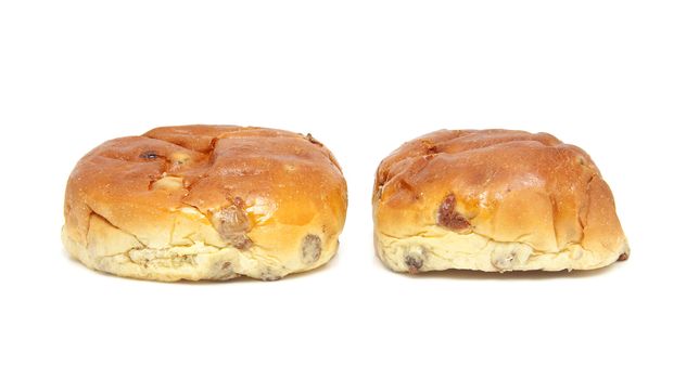 two raisin bread, also known as krentenbollen, isolated on white background