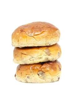 pile of raisin bread, also known as krentenbollen, isolated on white background