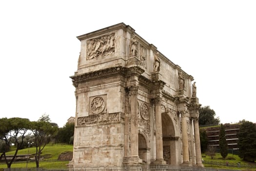 View of Arco Di Costantino (Arch of Constantine) in Rome, Italy. It was erected to commemorate Constantine I's victory over Maxentius at the Battle of Milvian Bridge on October 28, 312.The arch is 21 m high, 25.7 m wide and 7.4 m deep.